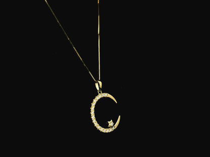 Diamond crescent moon pendant in 18K yellow gold by Emirates Diamonds