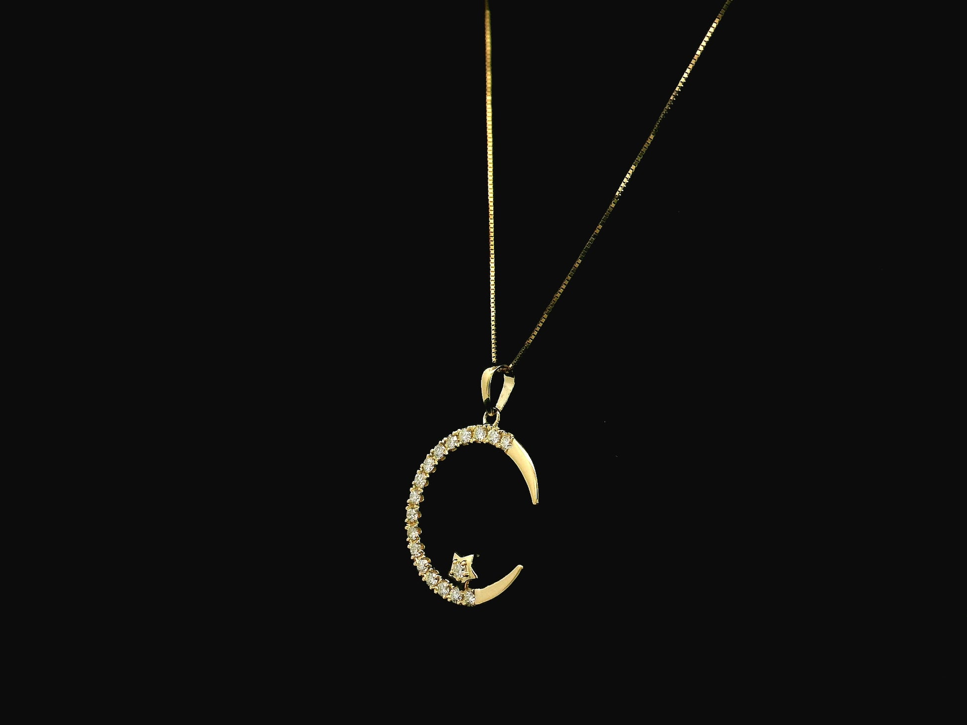 Diamond crescent moon pendant in 18K yellow gold by Emirates Diamonds