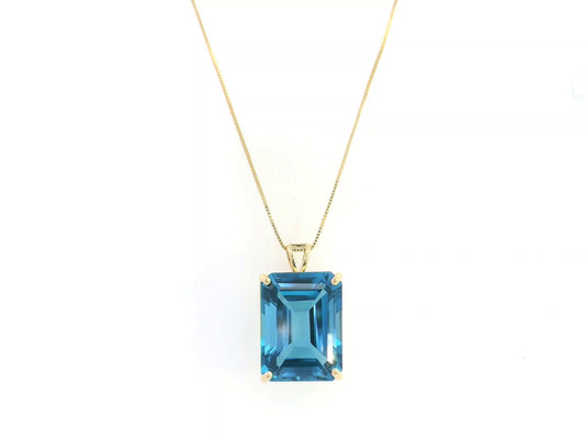 London Blue Topaz pendant in 18K yellow gold featuring a 14.77 carat emerald-cut natural London Blue Topaz