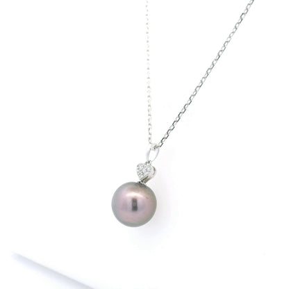 Tahitian black pearl diamond heart pendant in 18K white gold with natural diamond accent.