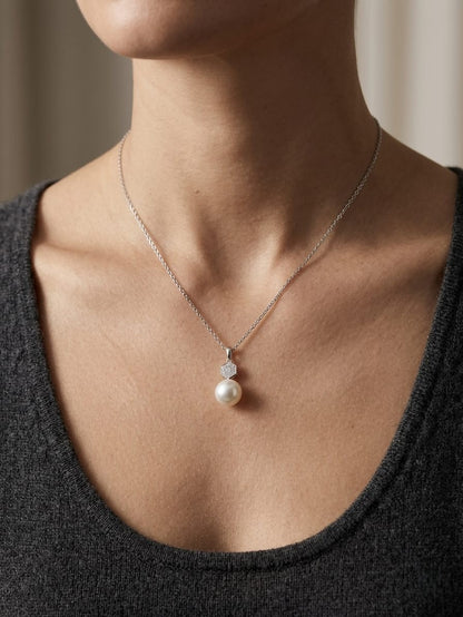 South Sea pearl pendant in 18K white gold with natural diamond geometric accent.
