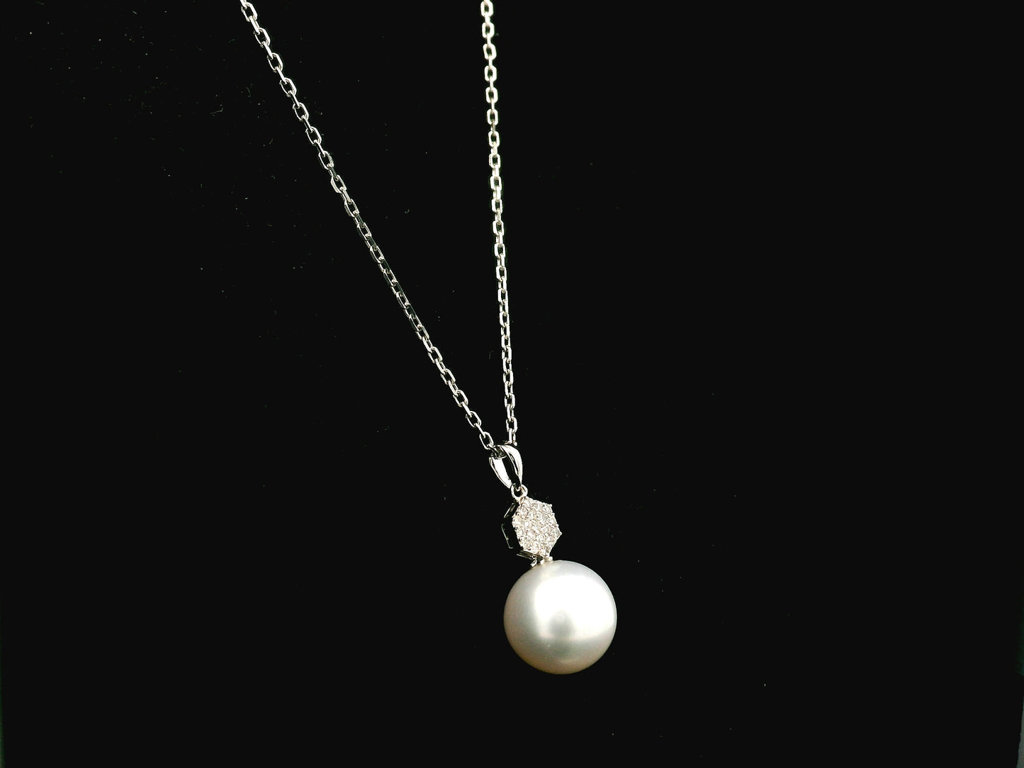 South Sea pearl pendant in 18K white gold with natural diamond geometric accent.