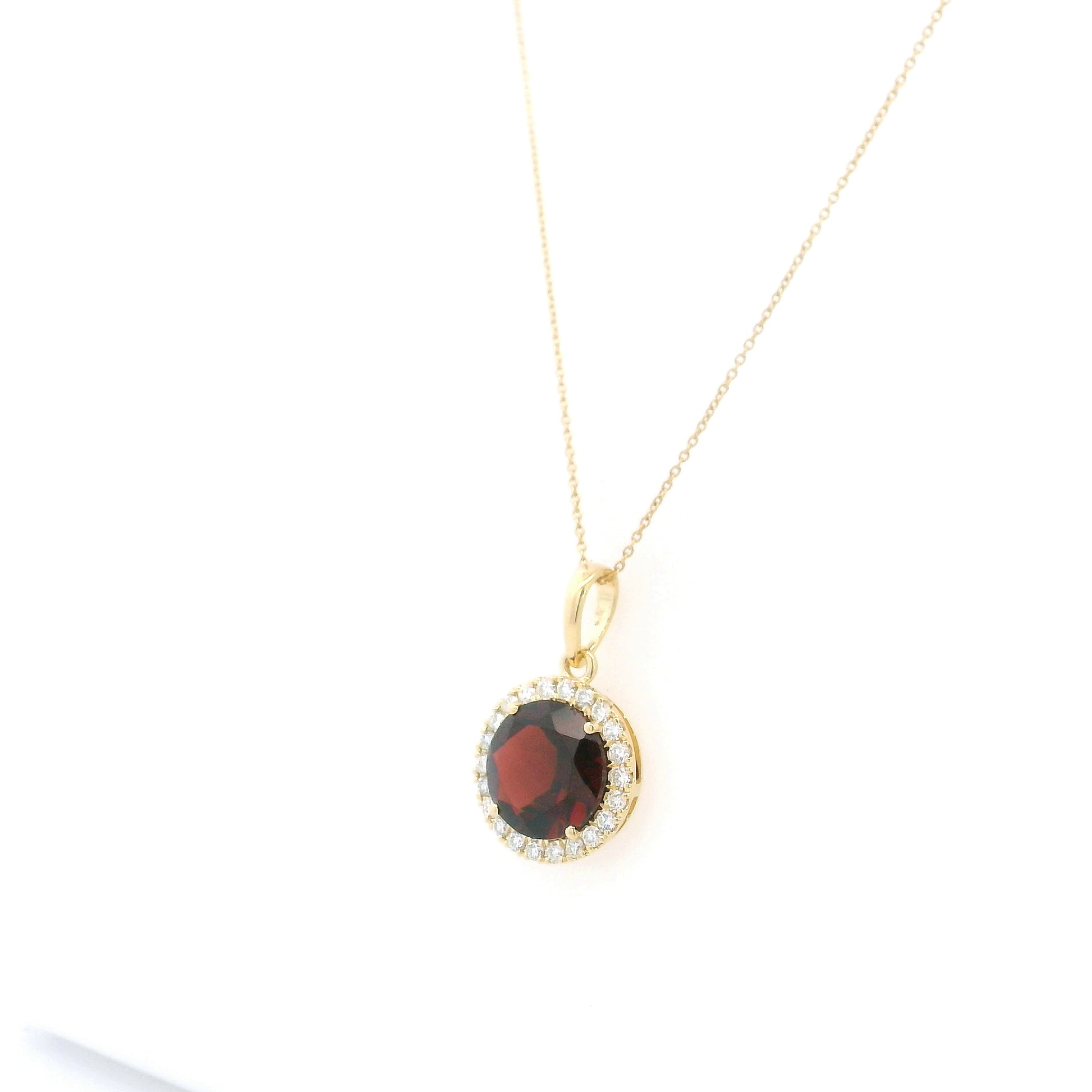 Round garnet diamond halo pendant in 18K yellow gold with 3.82 carat natural garnet
