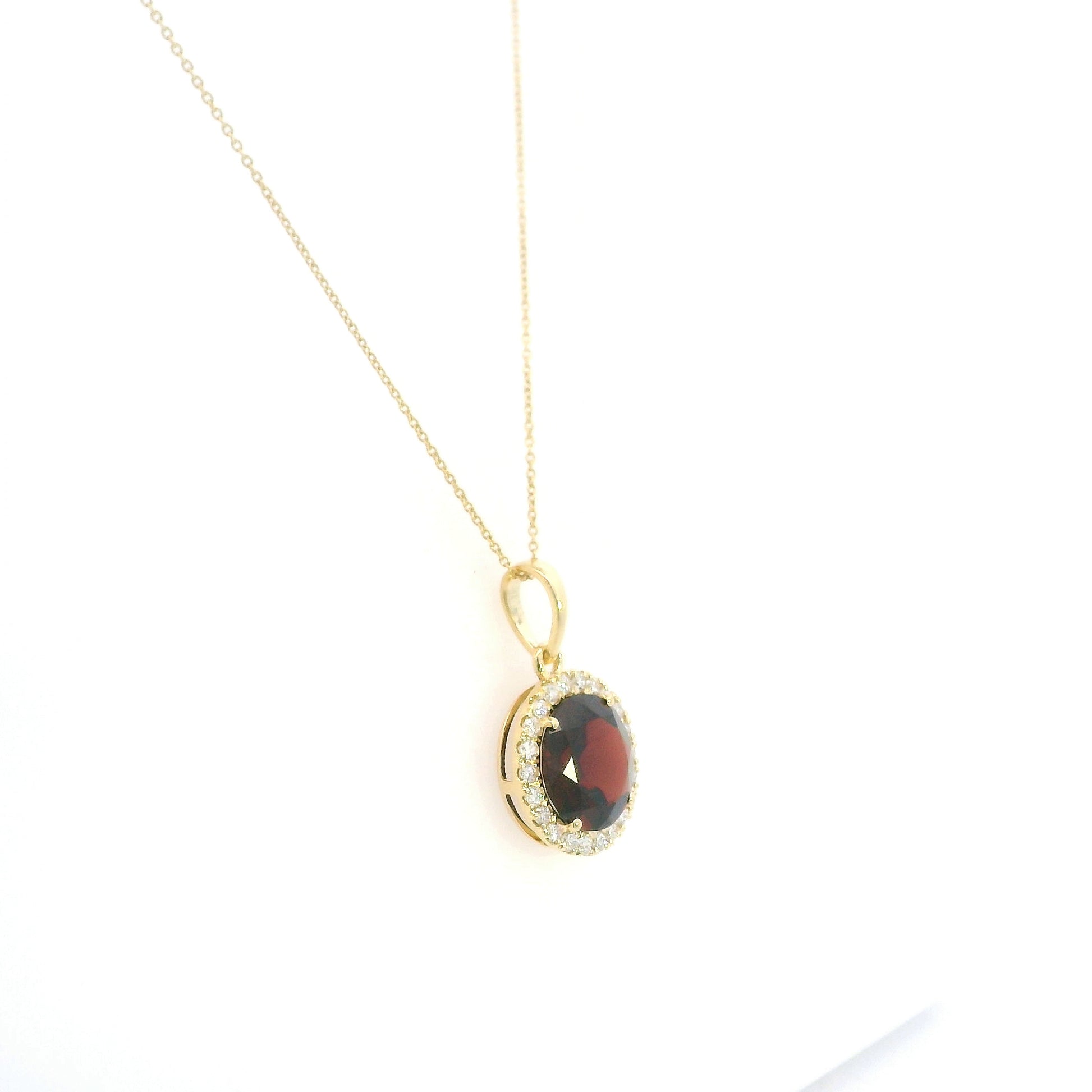 Round garnet diamond halo pendant in 18K yellow gold with 3.82 carat natural garnet