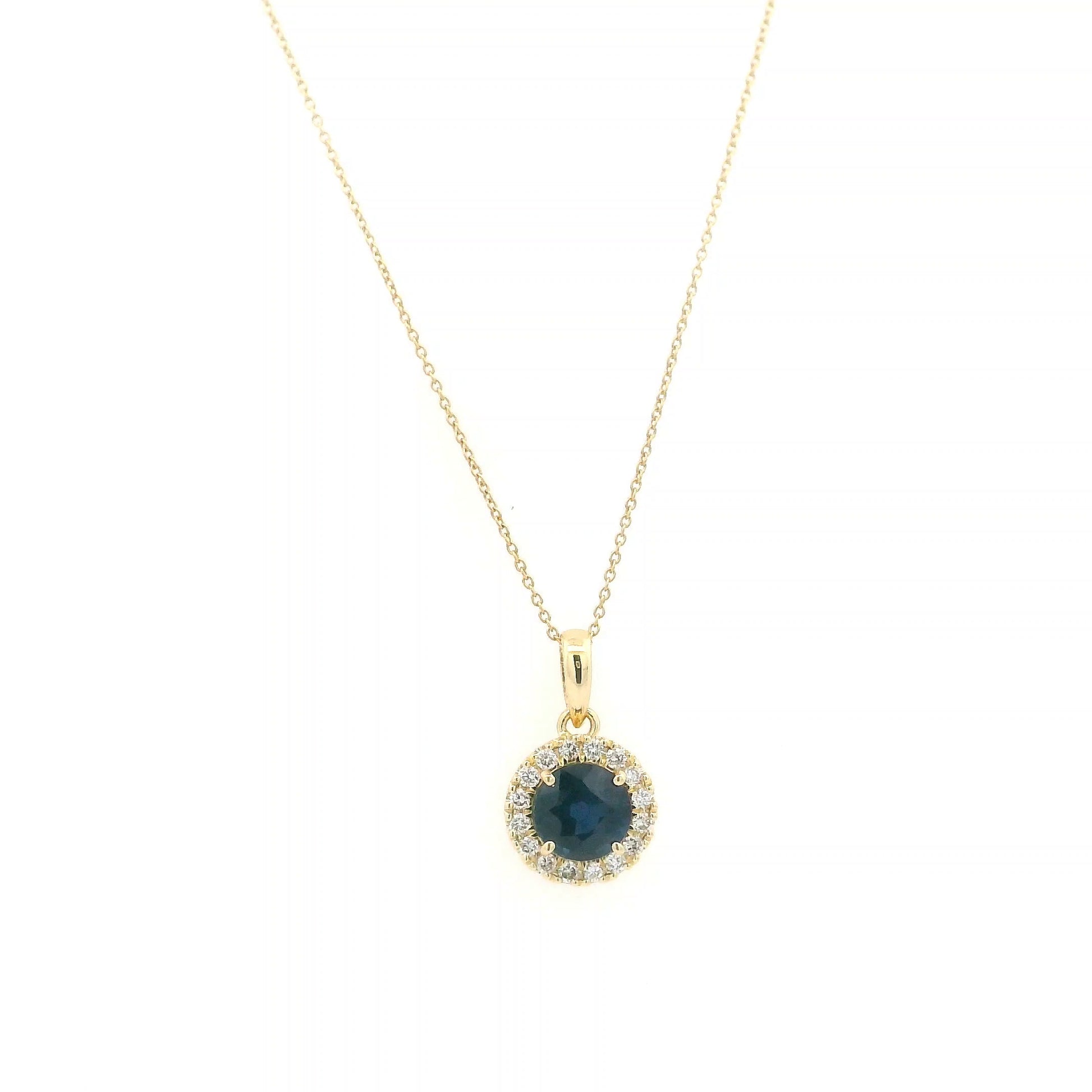 Round blue sapphire diamond halo pendant in 18K white gold.
