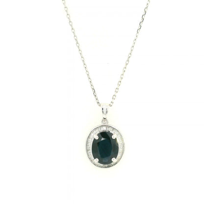 18K white gold oval blue sapphire pendant featuring a 2.71 carat natural blue sapphire surrounded by a baguette diamond halo with 0.32 carat natural diamonds. Pendant only, chain not included.