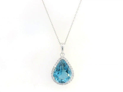 18K white gold pear shape London Blue Topaz pendant with diamond halo featuring a 9.10 carat natural London Blue Topaz and 0.39 carat natural diamonds.