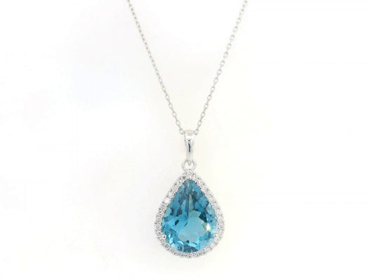 18K white gold pear shape London Blue Topaz pendant with diamond halo featuring a 9.10 carat natural London Blue Topaz and 0.39 carat natural diamonds.