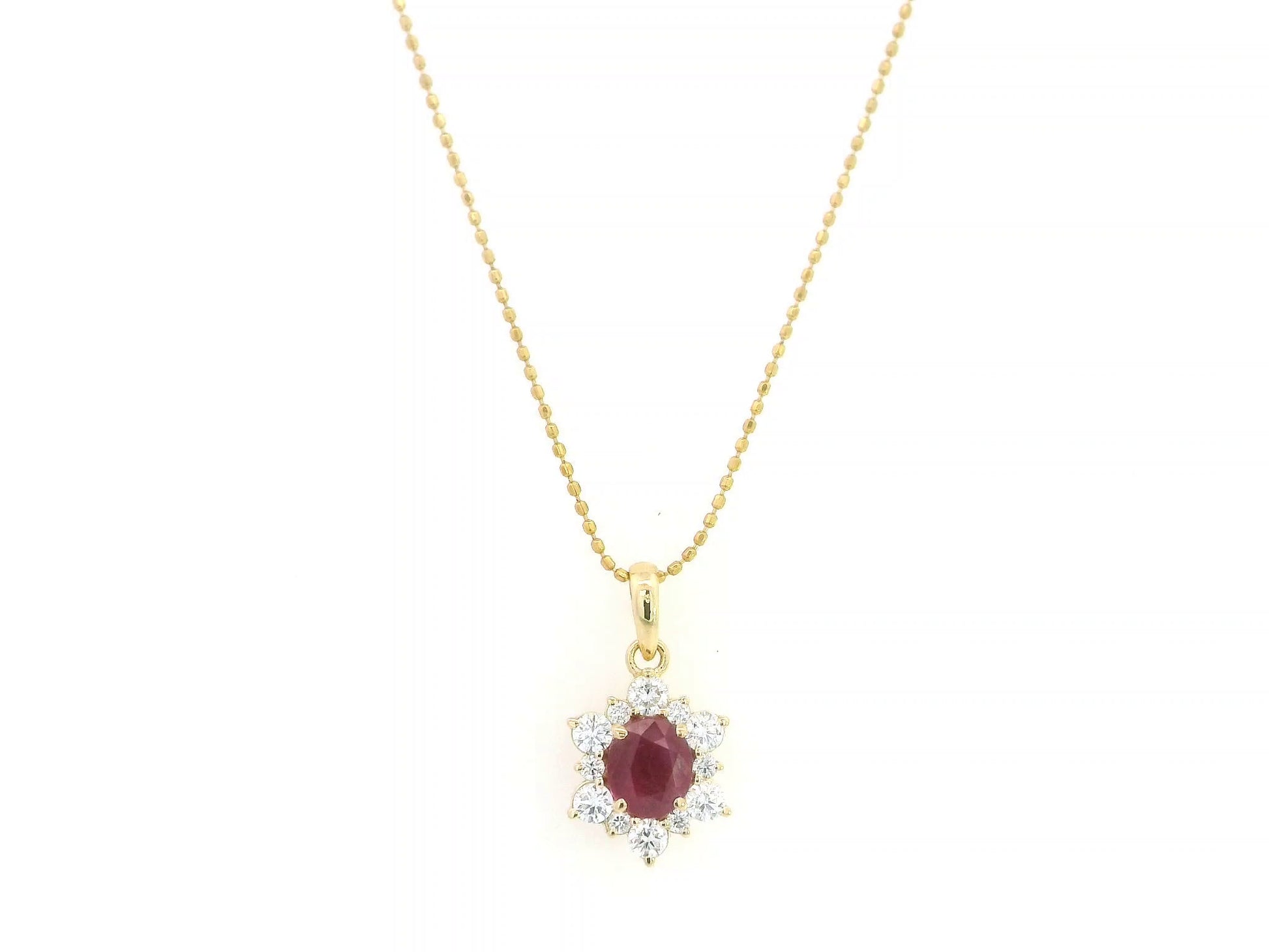 18K yellow gold oval ruby halo pendant featuring a 1.09 carat natural ruby surrounded by 0.48 carat natural diamonds in a floral-inspired halo design, supplied without a chain.