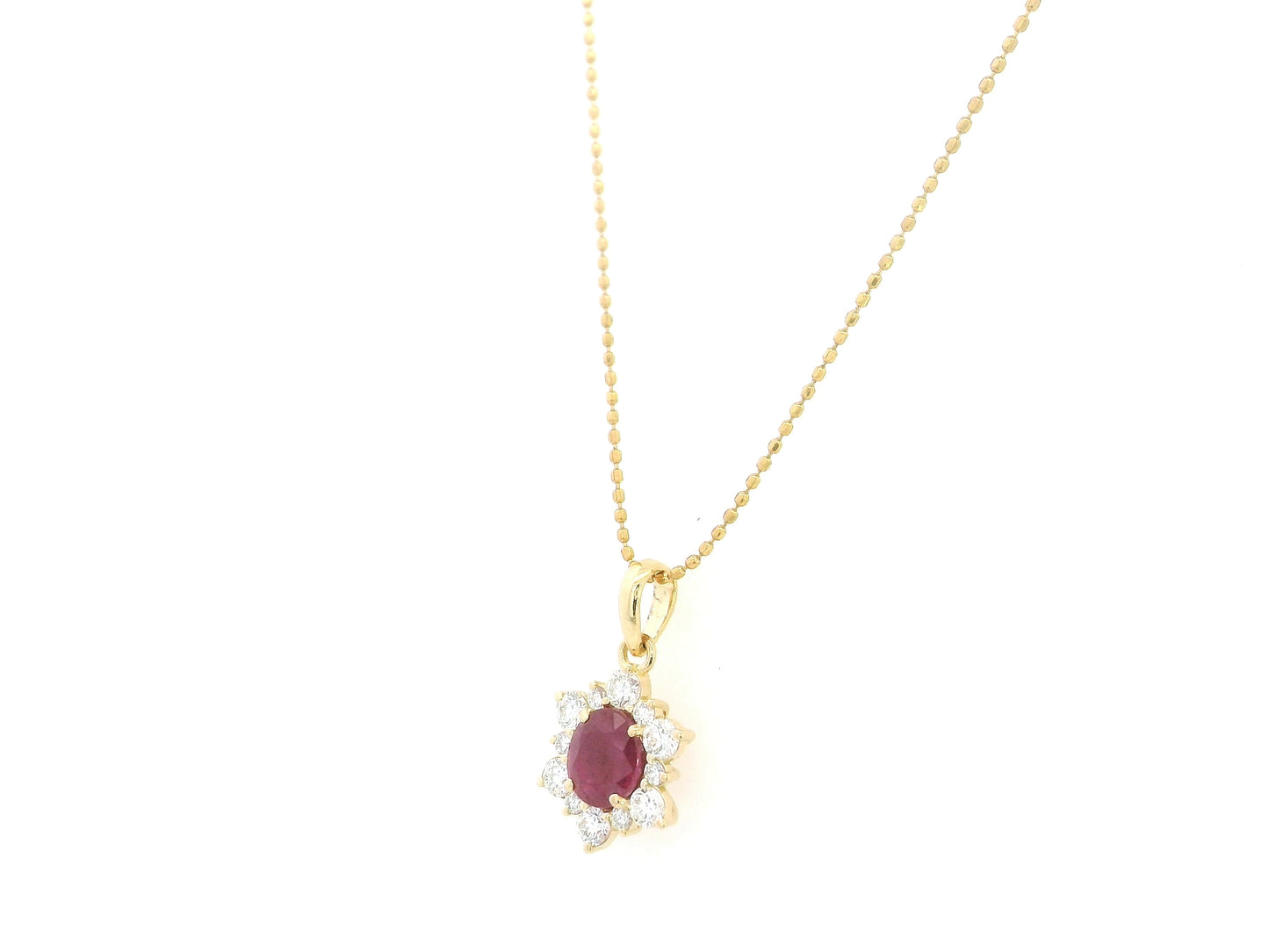 18K yellow gold oval ruby halo pendant featuring a 1.09 carat natural ruby surrounded by 0.48 carat natural diamonds in a floral-inspired halo design, supplied without a chain.