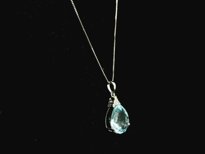 18K white gold pendant featuring a 10.82 carat natural pear-shaped aquamarine accented with 0.13 carat natural round brilliant diamonds. 