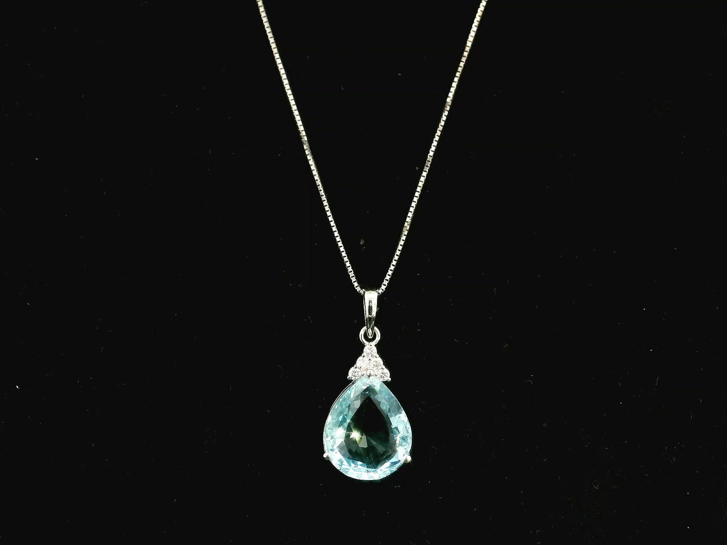 18K white gold pendant featuring a 10.82 carat natural pear-shaped aquamarine accented with 0.13 carat natural round brilliant diamonds. Chain not included.
