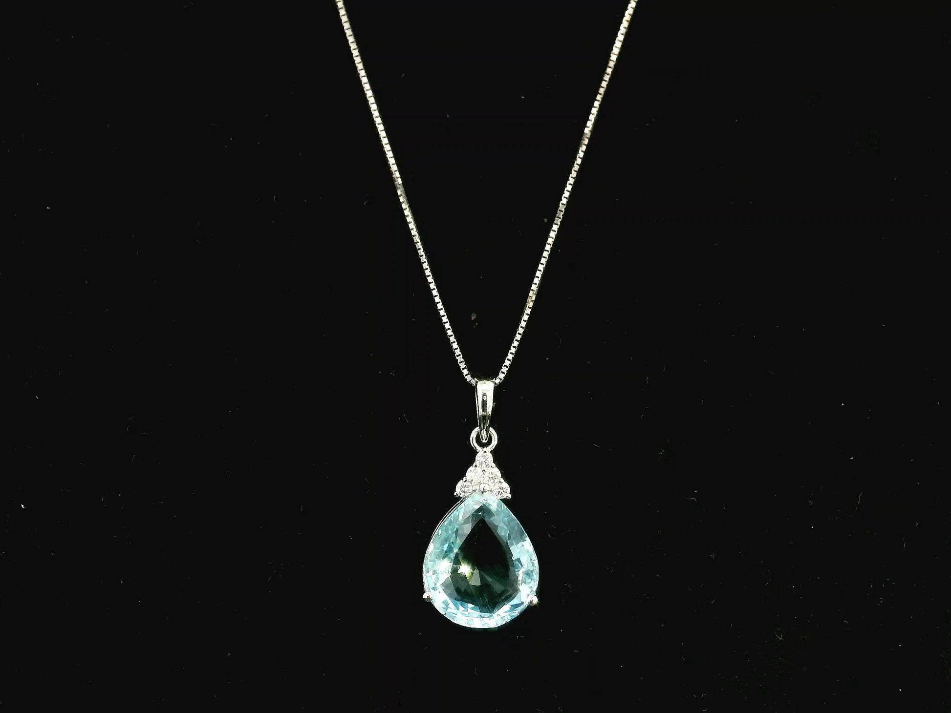 18K white gold pendant featuring a 10.82 carat natural pear-shaped aquamarine accented with 0.13 carat natural round brilliant diamonds. Chain not included.