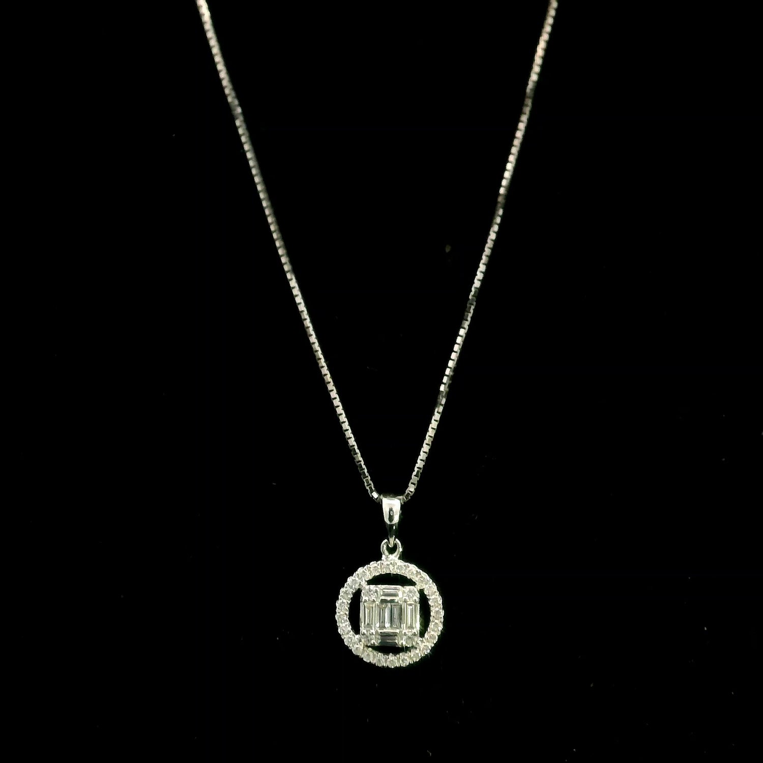 18K white gold diamond pendant featuring round and baguette natural diamonds in an emerald-cut inspired illusion cluster with a sparkling round diamond halo. Chain not included.