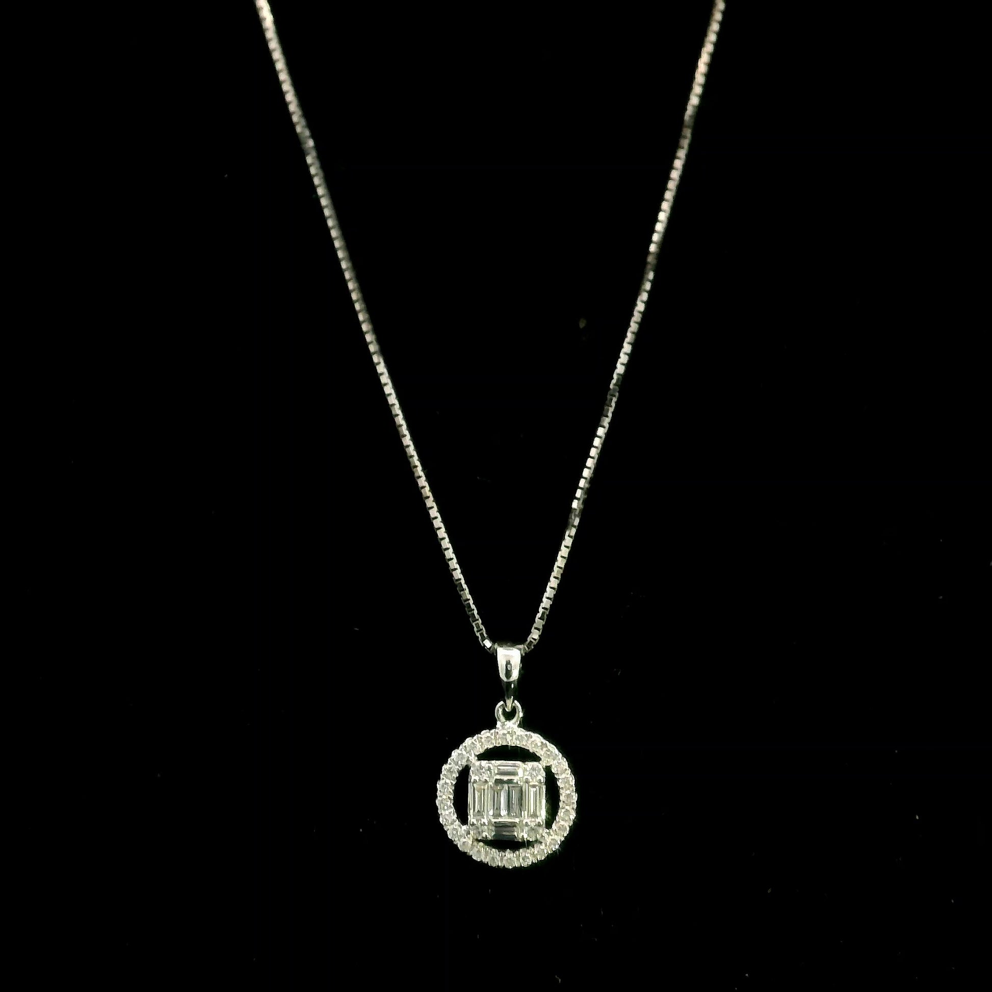 18K white gold diamond pendant featuring round and baguette natural diamonds in an emerald-cut inspired illusion cluster with a sparkling round diamond halo. Chain not included.