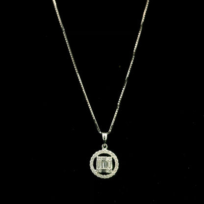 18K white gold diamond pendant featuring round and baguette natural diamonds in an emerald-cut inspired illusion cluster with a sparkling round diamond halo. Chain not included.