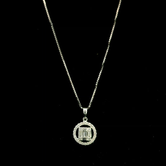 18K white gold diamond pendant featuring round and baguette natural diamonds in an emerald-cut inspired illusion cluster with a sparkling round diamond halo. Chain not included.