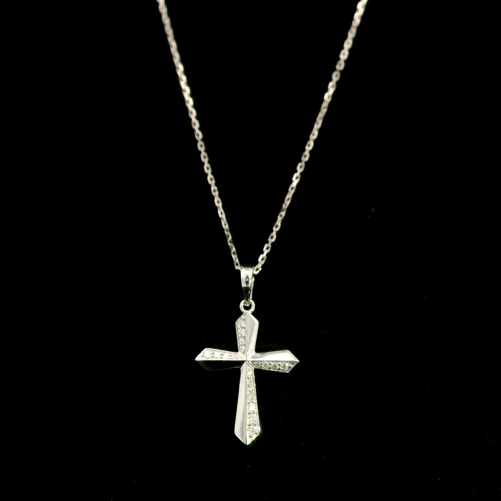 18K white gold diamond cross pendant featuring 0.23 carat natural round brilliant diamonds in a modern geometric cross design.