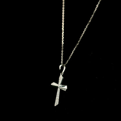 18K white gold diamond cross pendant featuring 0.23 carat natural round brilliant diamonds in a modern geometric cross design.