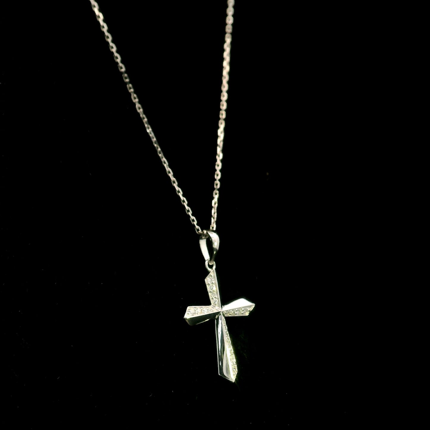 18K white gold diamond cross pendant featuring 0.23 carat natural round brilliant diamonds in a modern geometric cross design.