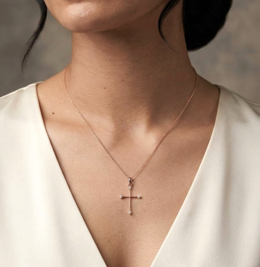 18K rose gold minimalist natural diamond cross pendant with four round brilliant diamonds.