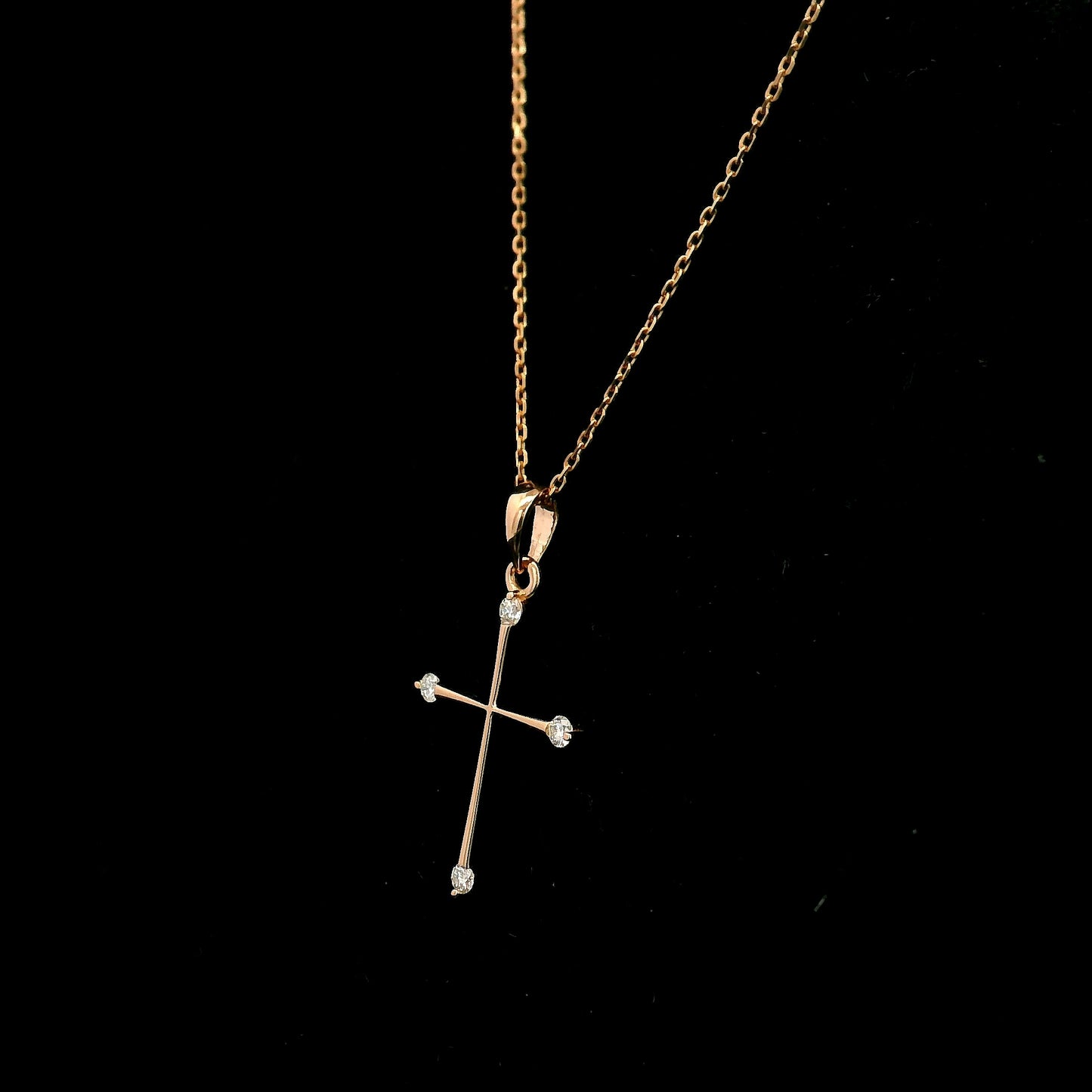 18K rose gold minimalist natural diamond cross pendant with four round brilliant diamonds.