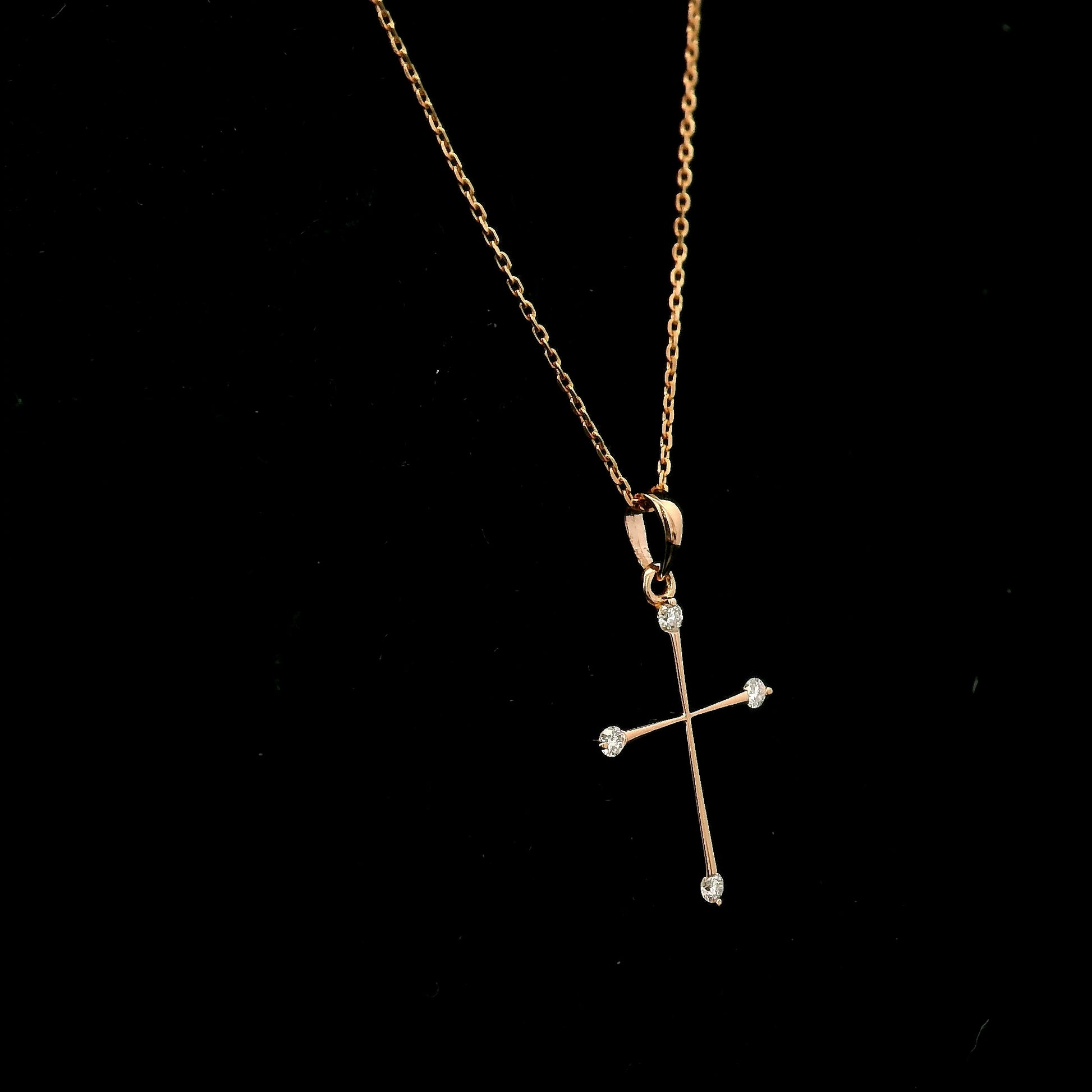 18K rose gold minimalist natural diamond cross pendant with four round brilliant diamonds.