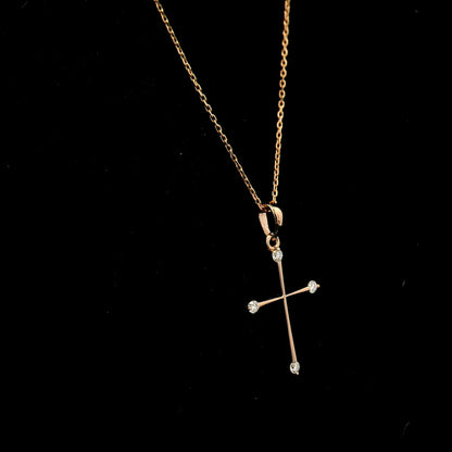 18K rose gold minimalist natural diamond cross pendant with four round brilliant diamonds.