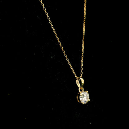 18K yellow gold solitaire pendant featuring a 0.70 carat GIA certified round brilliant natural diamond in a classic four-prong setting, supplied without a chain.