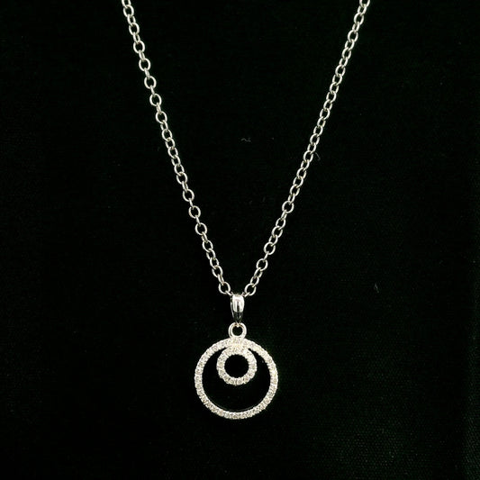 Diamond circle pendant with interlocking open-circle design in 18K white gold, set with round brilliant diamonds.