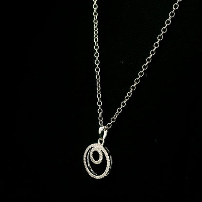 Diamond circle pendant with interlocking open-circle design in 18K white gold, set with round brilliant diamonds.