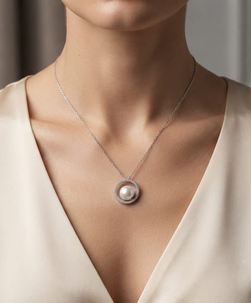 Fresh Water Pearl and diamond pendant necklace with round pearl, open diamond circle and 18K white gold chain.