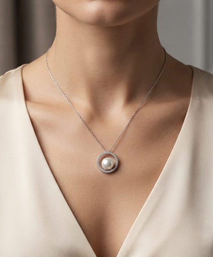 Fresh Water Pearl and diamond pendant necklace with round pearl, open diamond circle and 18K white gold chain.