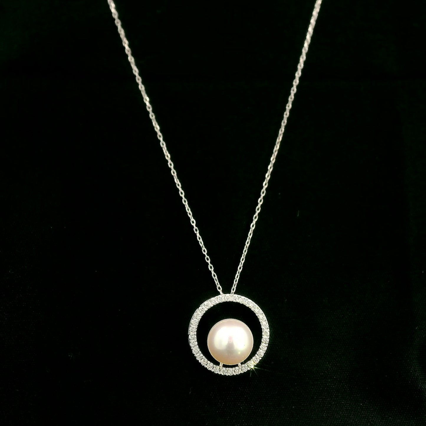 Fresh Water Pearl and diamond pendant necklace with round pearl, open diamond circle and 18K white gold chain.