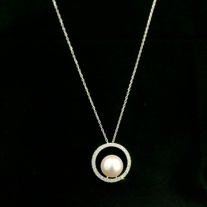 Fresh Water Pearl and diamond pendant necklace with round pearl, open diamond circle and 18K white gold chain.