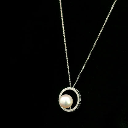 Fresh Water Pearl and diamond pendant necklace with round pearl, open diamond circle and 18K white gold chain.