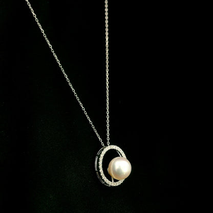 Fresh water Pearl and diamond pendant necklace with round pearl, open diamond circle and 18K white gold chain.