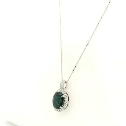 Oval sapphire and diamond halo pendant in 18K white gold with diamond-set bail