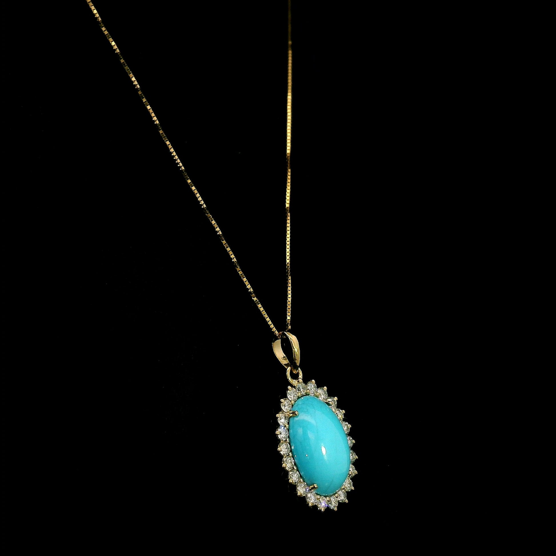 Oval turquoise and diamond halo pendant in 18K yellow gold with 3.81 carat turquoise and round diamonds