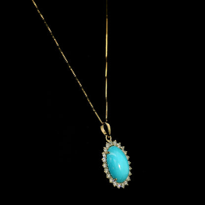 Oval turquoise and diamond halo pendant in 18K yellow gold with 3.81 carat turquoise and round diamonds