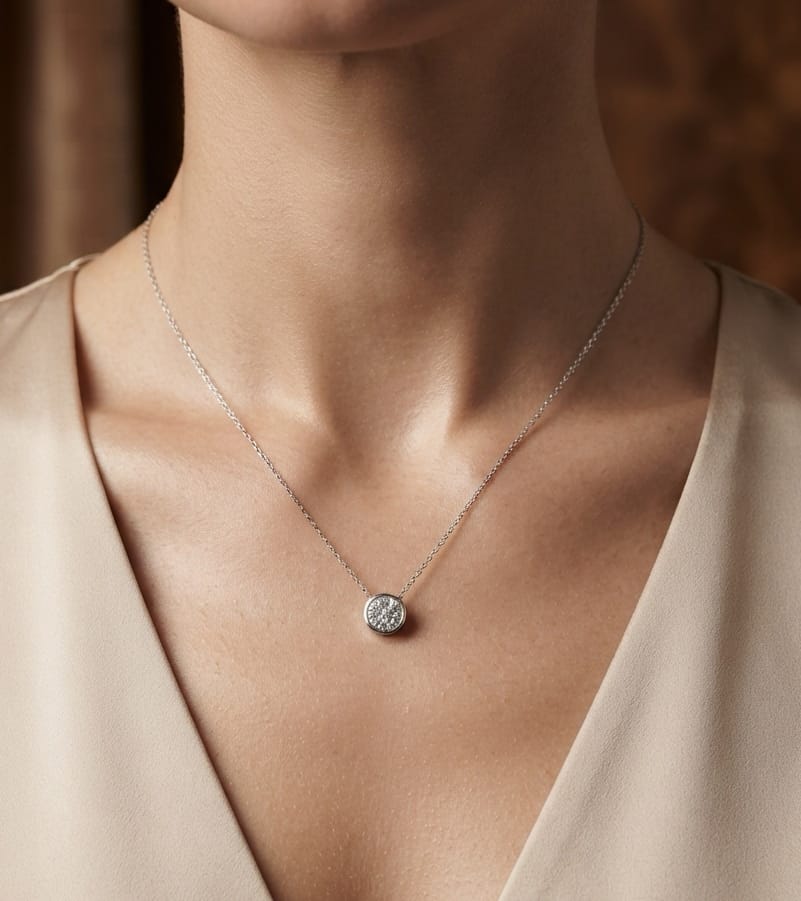 18K yellow gold diamond cross pendant set with 3.22 carats of princess cut diamonds and a diamond-set bail.