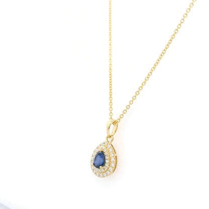 Pear shaped blue sapphire and double diamond halo pendant in 18K yellow gold
