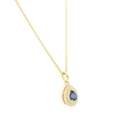 Pear shaped blue sapphire and double diamond halo pendant in 18K yellow gold