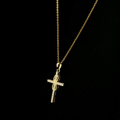 Diamond cross pendant in 18K yellow gold with round brilliant diamonds and an intertwined gold centre design