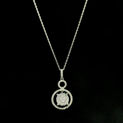 Diamond circle pendant in 18K white gold featuring a suspended diamond cluster with open circular diamond details.