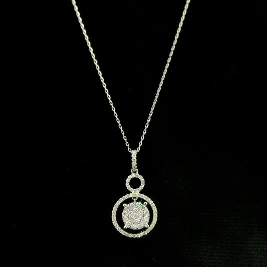 Diamond circle pendant in 18K white gold featuring a suspended diamond cluster with open circular diamond details.