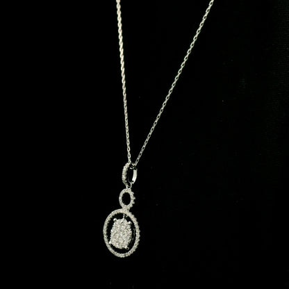 Diamond circle pendant in 18K white gold featuring a suspended diamond cluster with open circular diamond details.