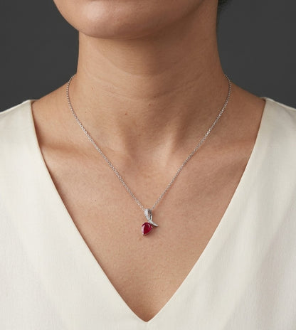 Pear shaped ruby and diamond pendant in 18K white gold