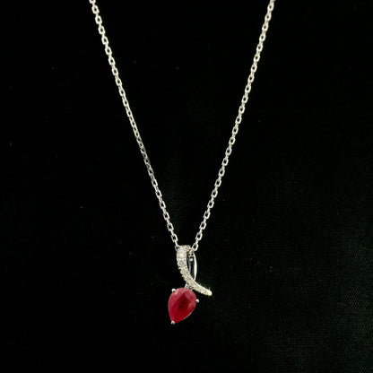 Pear shaped ruby and diamond pendant in 18K white gold