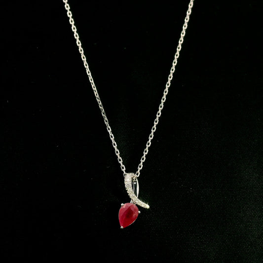 Pear shaped ruby and diamond pendant in 18K white gold